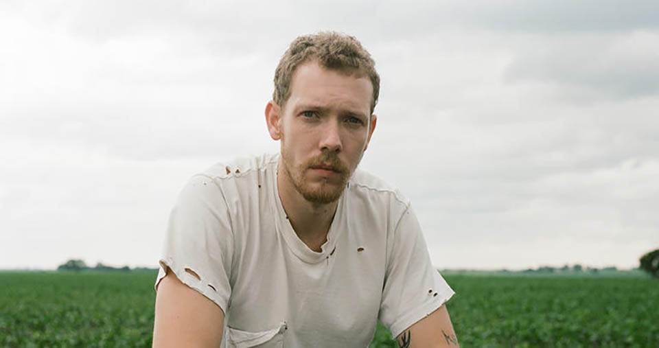Matt Maeson in a field